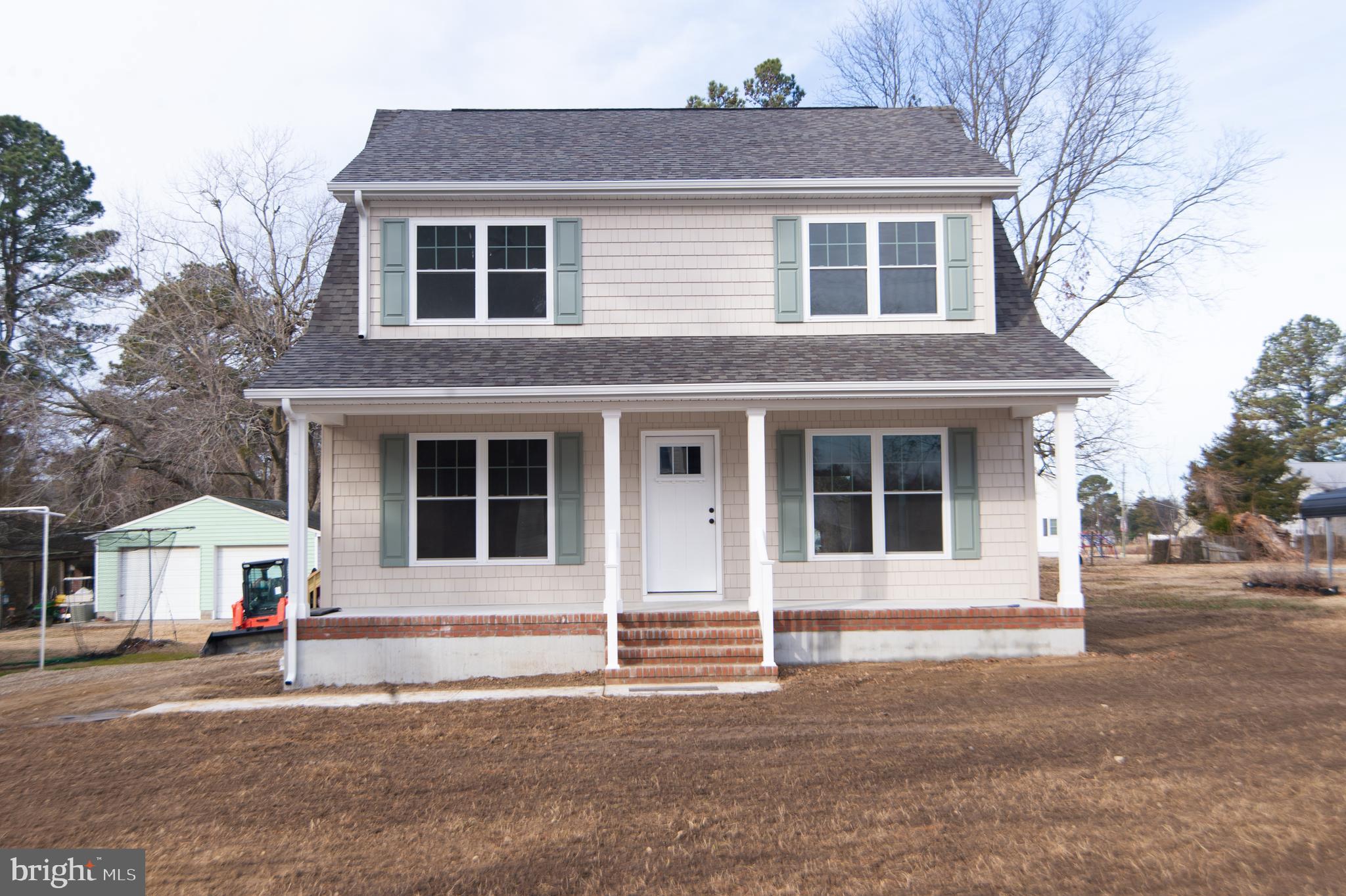120 Academy Street Secretary, MD 21664 - Photo 1 of 46 a front view of a house with a yard