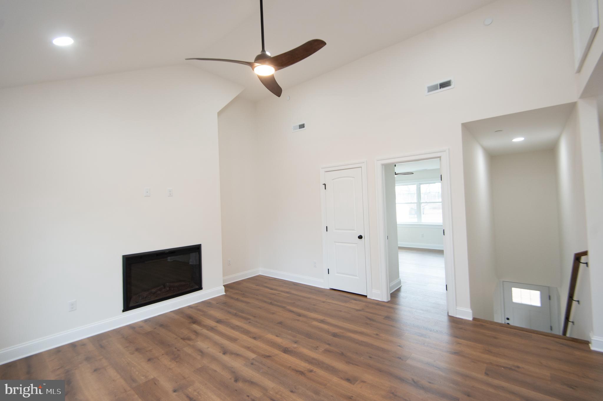 120 Academy Street Secretary, MD 21664 - Photo 22 of 46 a view of empty room with wooden floor