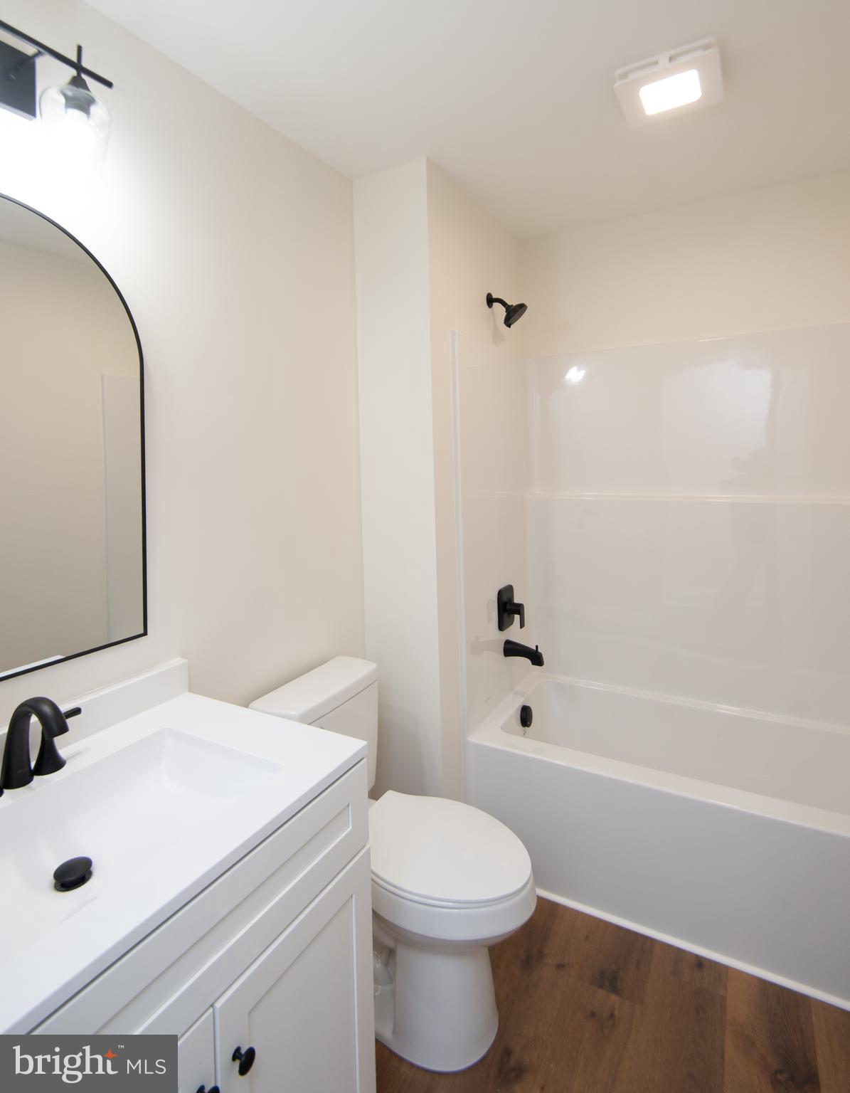 120 Academy Street Secretary, MD 21664 - Photo 29 of 46 a bathroom with a sink a toilet and shower