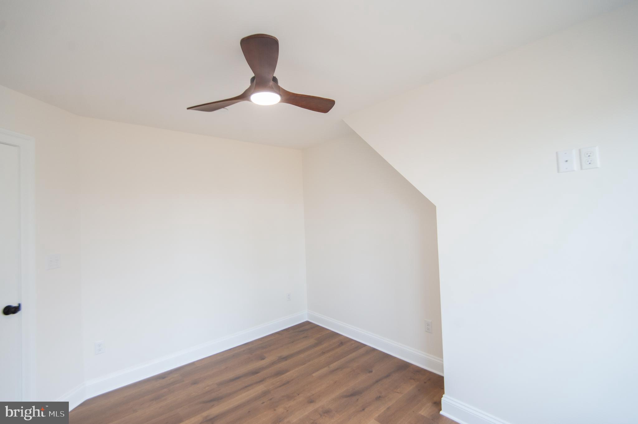 120 Academy Street Secretary, MD 21664 - Photo 33 of 46 a view of a hardwood floor in a ceiling fan