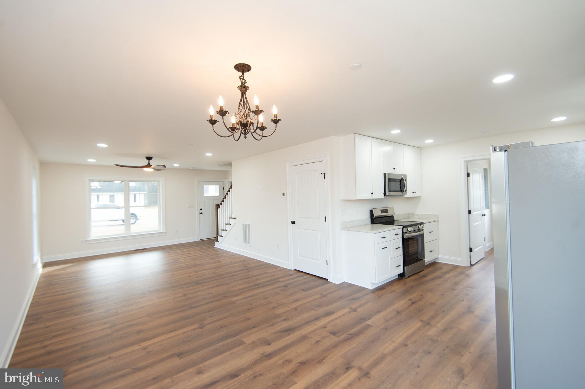 120 Academy Street Secretary, MD 21664 - Photo 8 of 46 a view of a kitchen and a chandelier