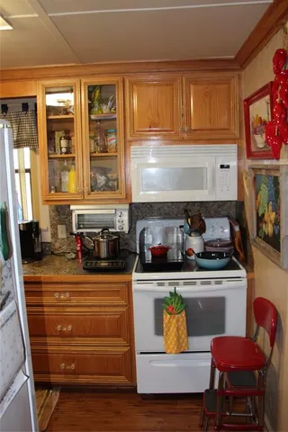 a view of a livingroom with furniture and a wooden floor