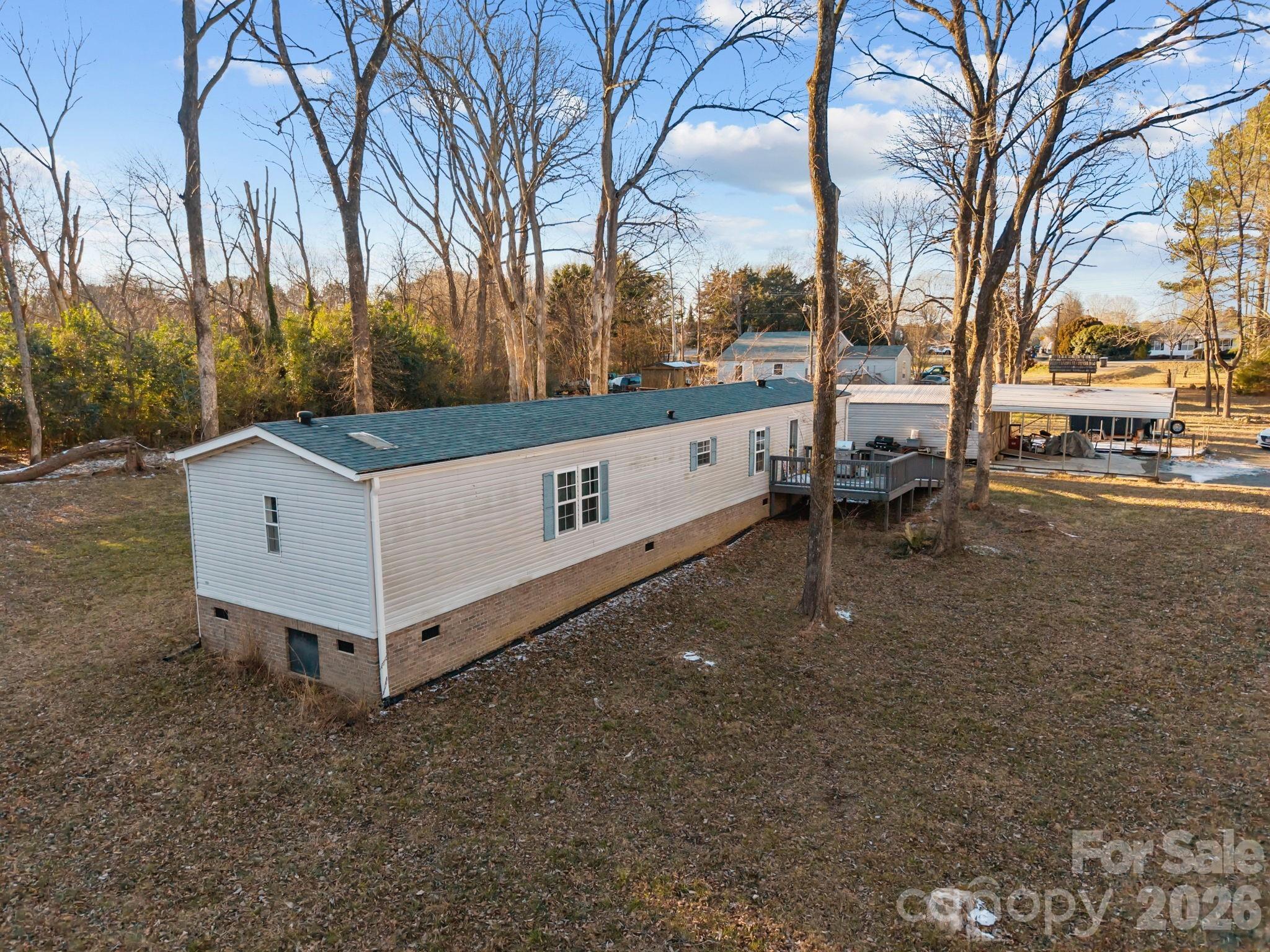 5819 Mt Gallant Road Rock Hill, SC 29732 - Photo 13 of 20 a view of a white house with a yard and sitting area