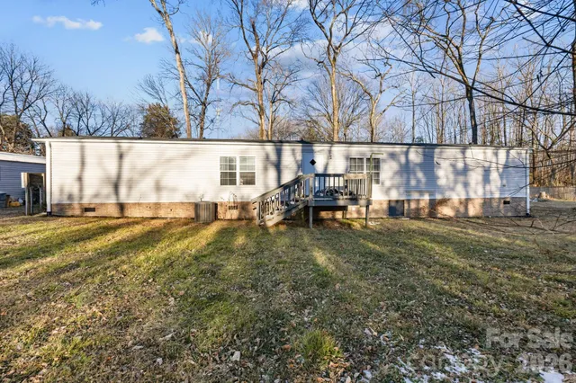 a view of outdoor space with deck and tree