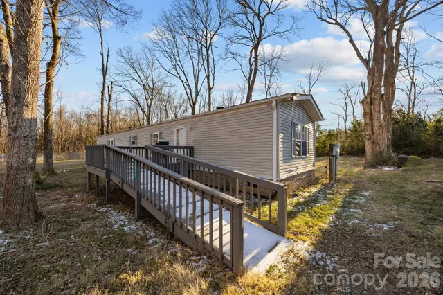 a view of a house with wooden fence