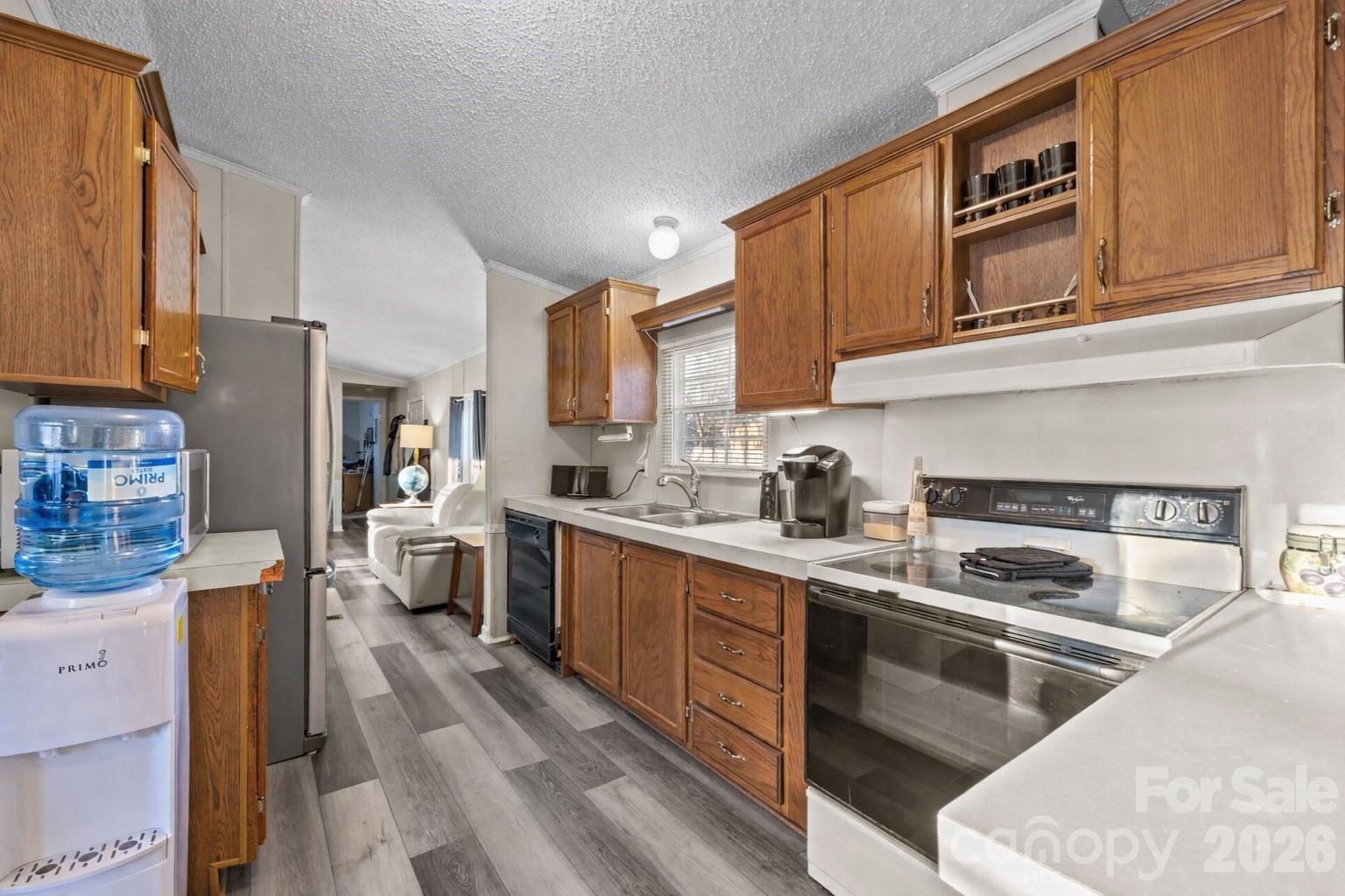 5819 Mt Gallant Road Rock Hill, SC 29732 - Photo 7 of 20 a kitchen with stainless steel appliances granite countertop a stove a sink dishwasher and a refrigerator