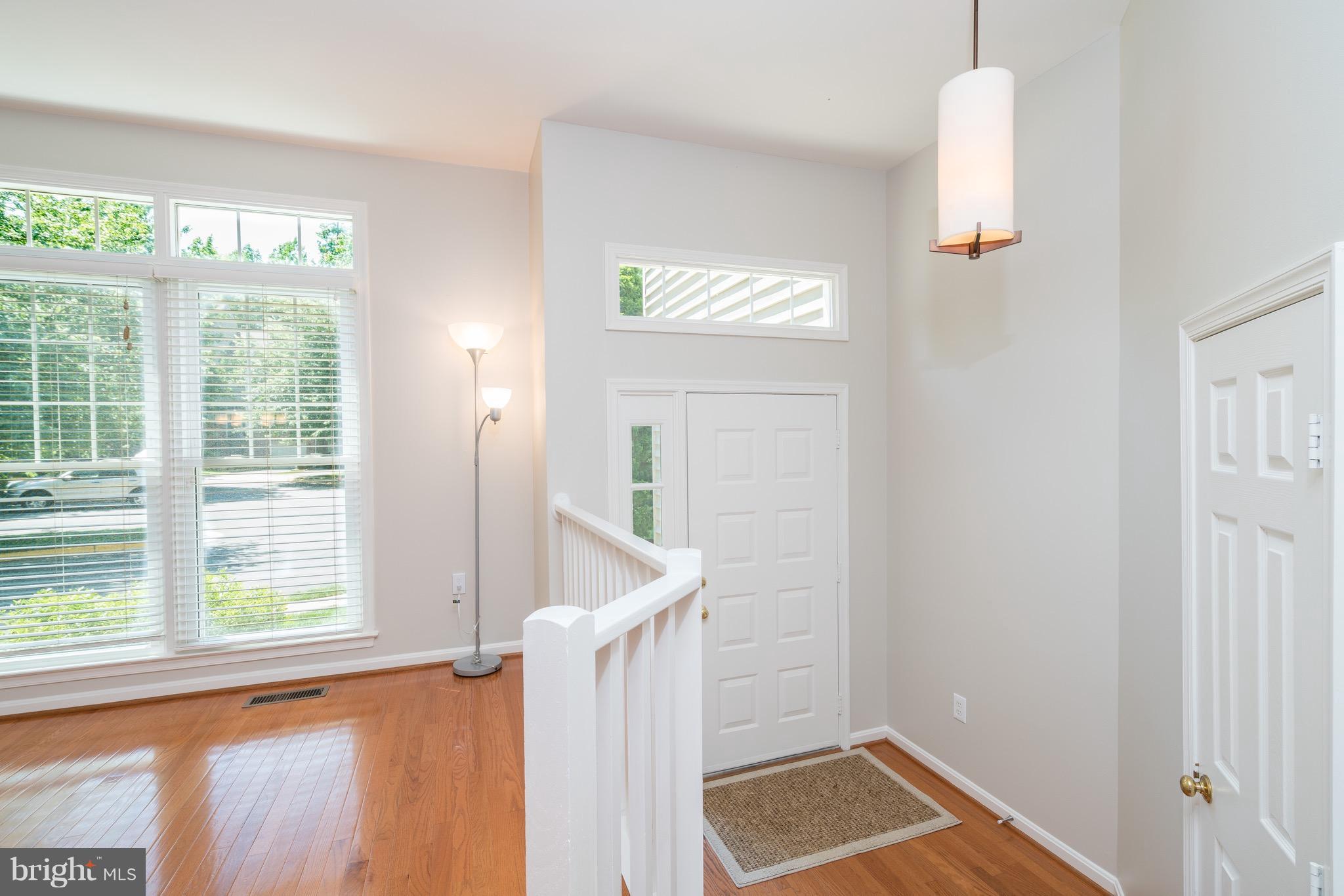 1211 Weatherstone Court Reston, VA 20194 - Photo 2 of 30 a view of a hallway with windows and entryway