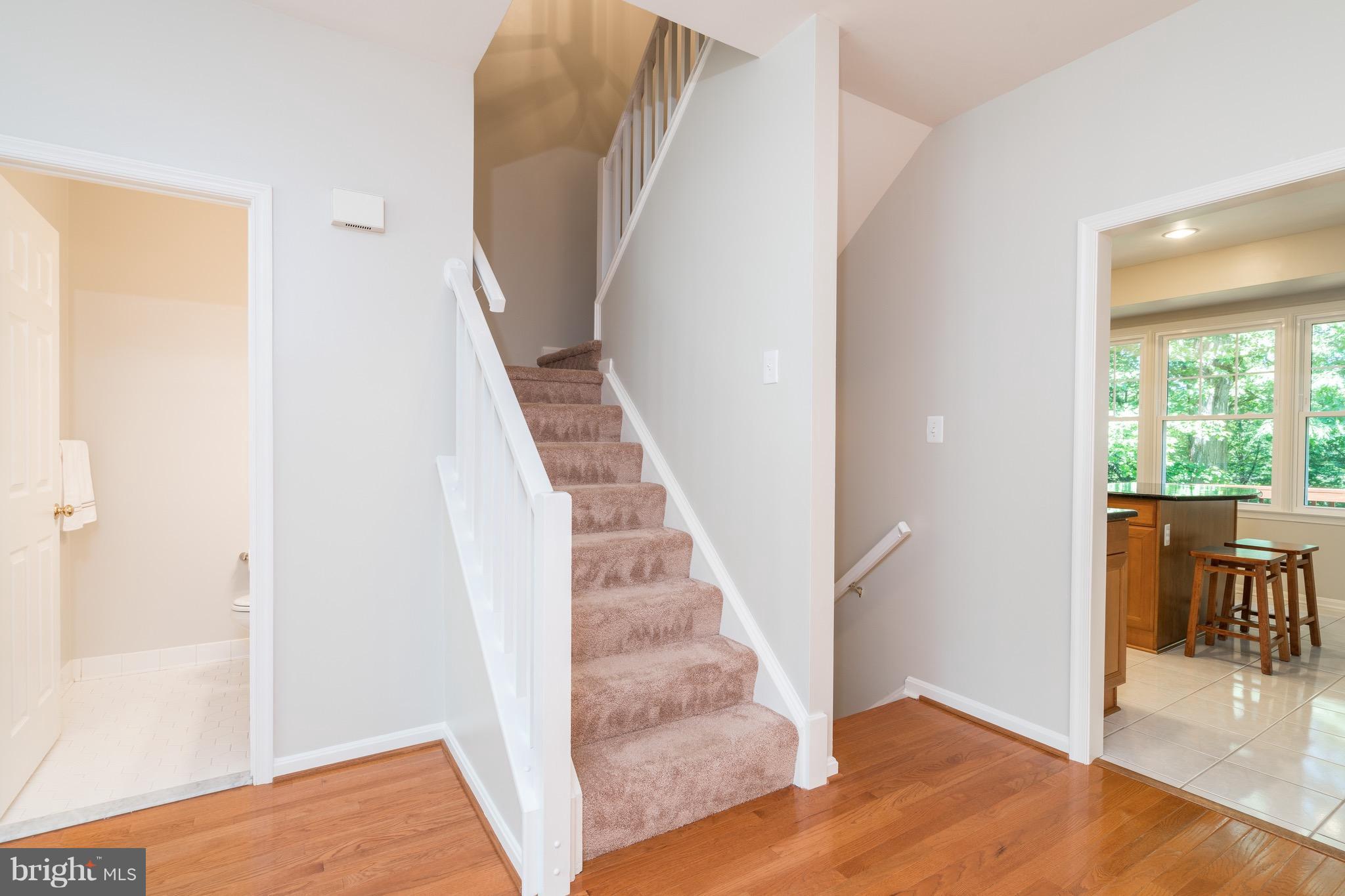 1211 Weatherstone Court Reston, VA 20194 - Photo 12 of 30 a view of a hallway with wooden floor and entryway