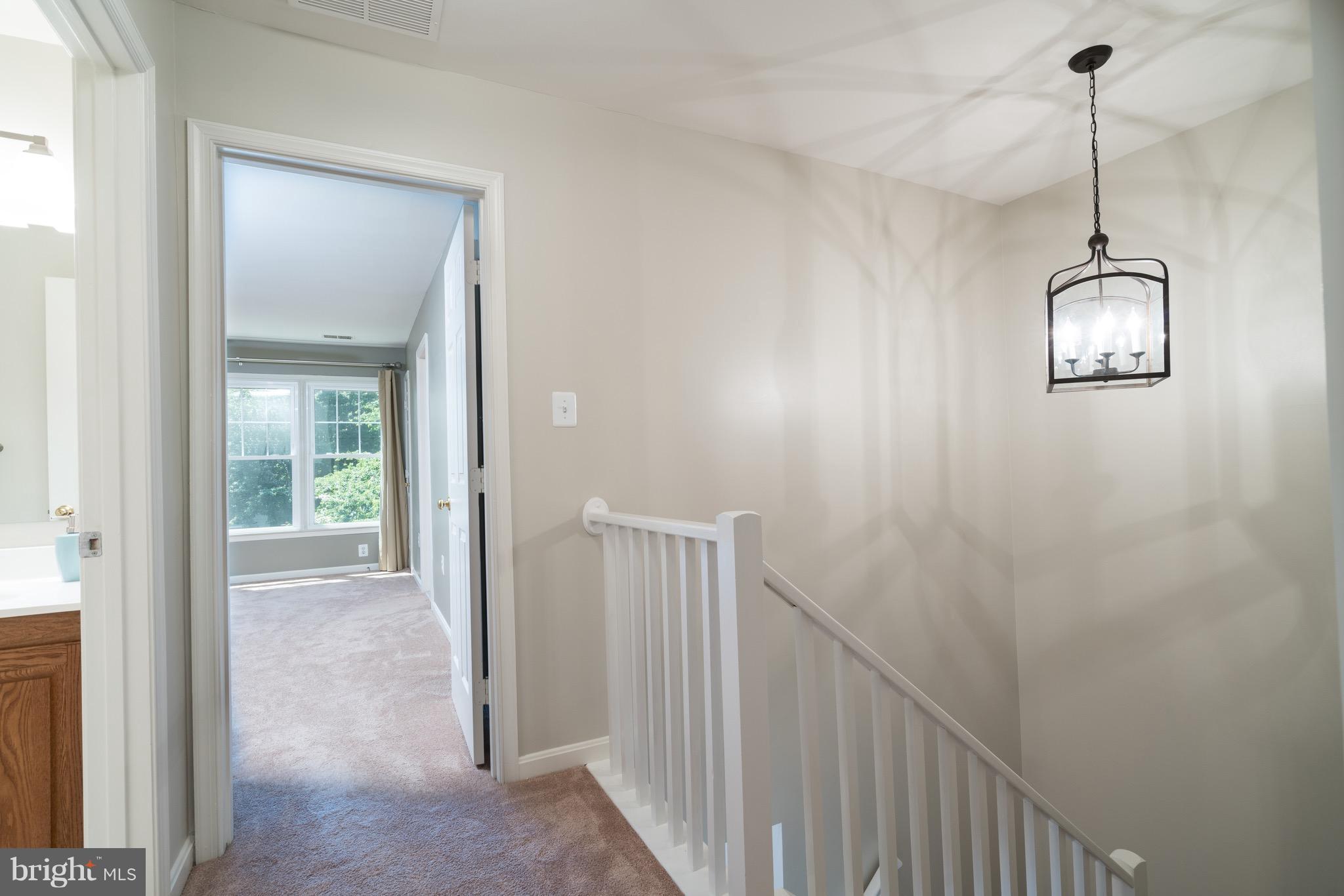 1211 Weatherstone Court Reston, VA 20194 - Photo 13 of 30 a view of a hallway with a window