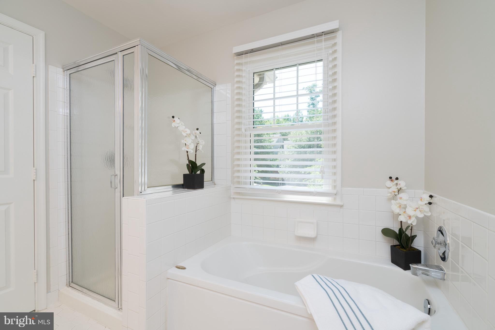 1211 Weatherstone Court Reston, VA 20194 - Photo 17 of 30 a white bath tub sitting next to a white sink