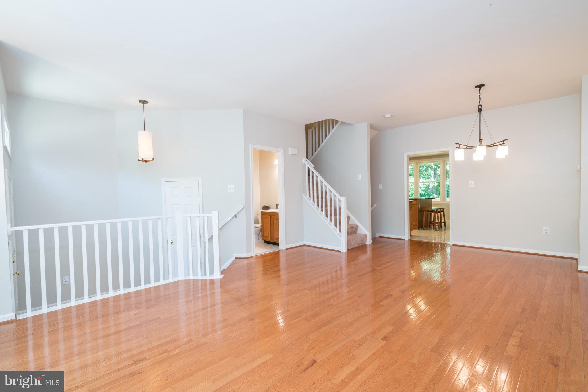 1211 Weatherstone Court Reston, VA 20194 - Photo 4 of 30 a view of an empty room with wooden floor
