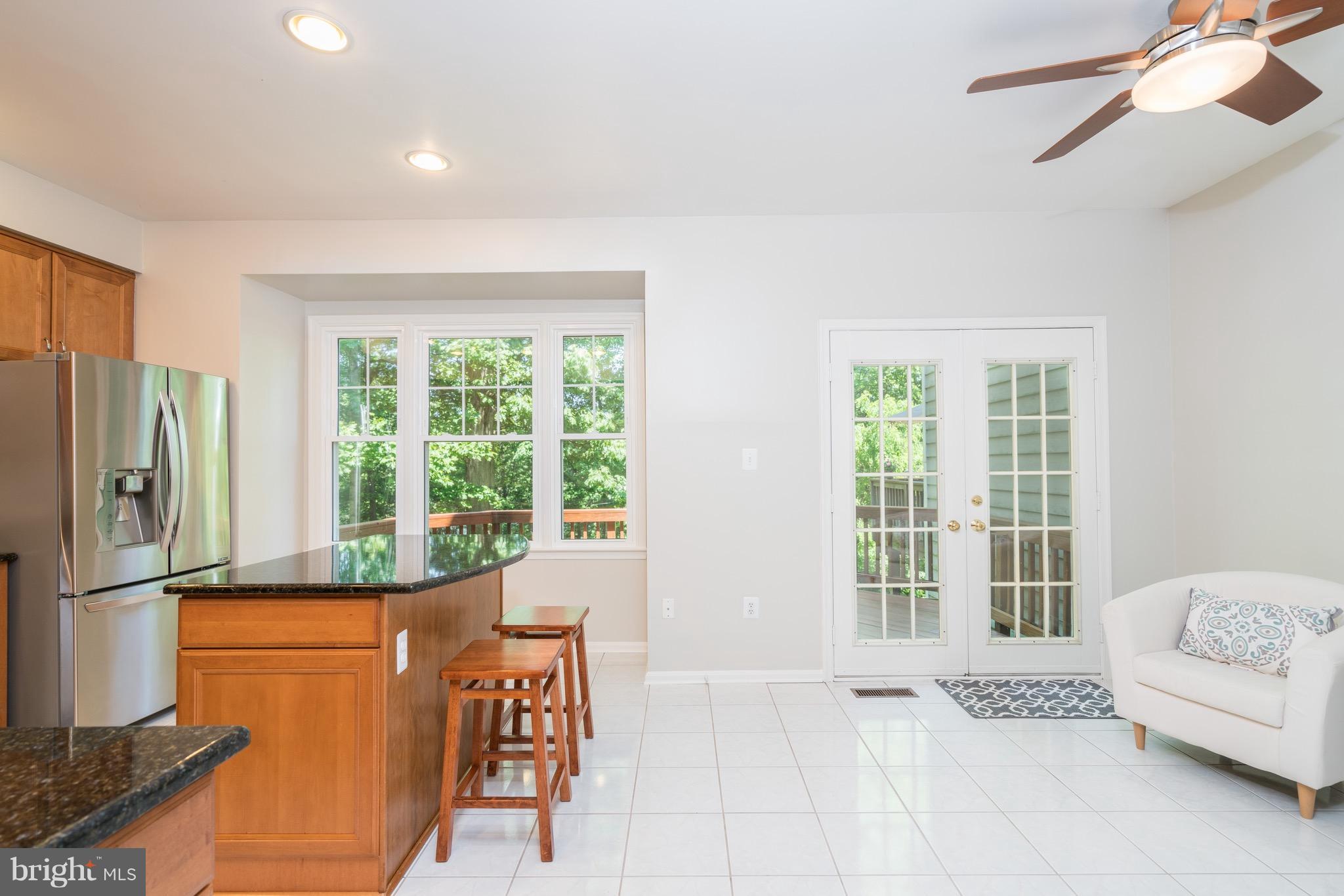 1211 Weatherstone Court Reston, VA 20194 - Photo 6 of 30 a living room with furniture and a window
