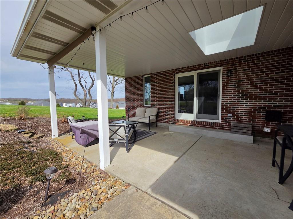 340 Westbrook Drive Butler, PA 16001 - Photo 24 of 25 a view of a patio with table and chairs under an umbrella