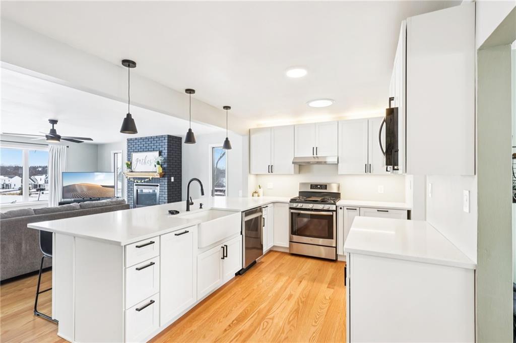 340 Westbrook Drive Butler, PA 16001 - Photo 5 of 25 a kitchen with white cabinets and stainless steel appliances