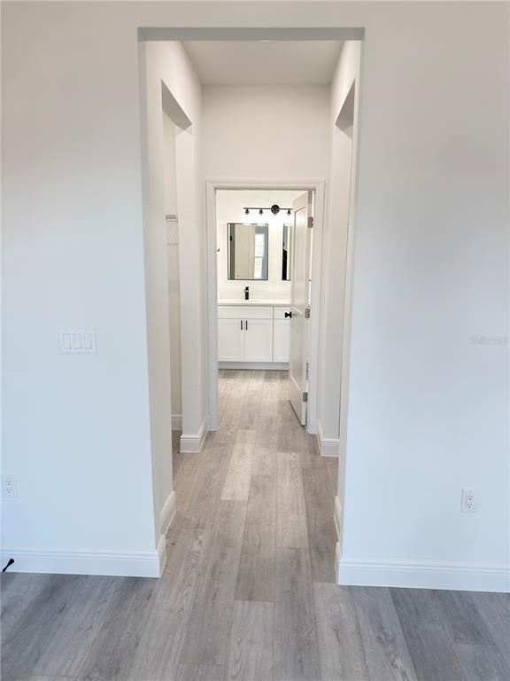 4650 Southwest 139th Place Ocala, FL 34473 - Photo 14 of 49 a view of a hallway with wooden floor