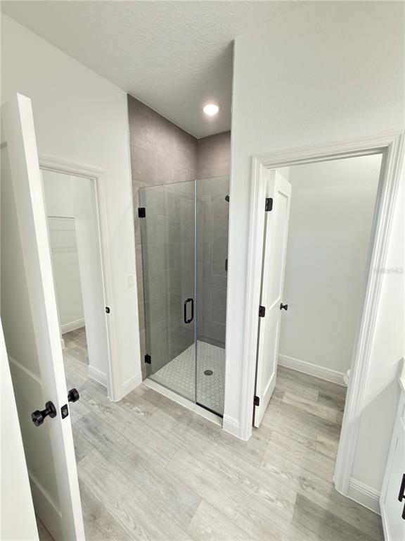 4650 Southwest 139th Place Ocala, FL 34473 - Photo 18 of 49 a view of a bathroom with a shower and a tub