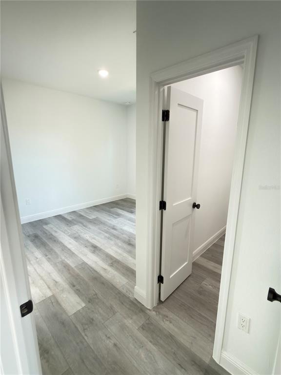 4650 Southwest 139th Place Ocala, FL 34473 - Photo 25 of 49 an empty room with wooden floor