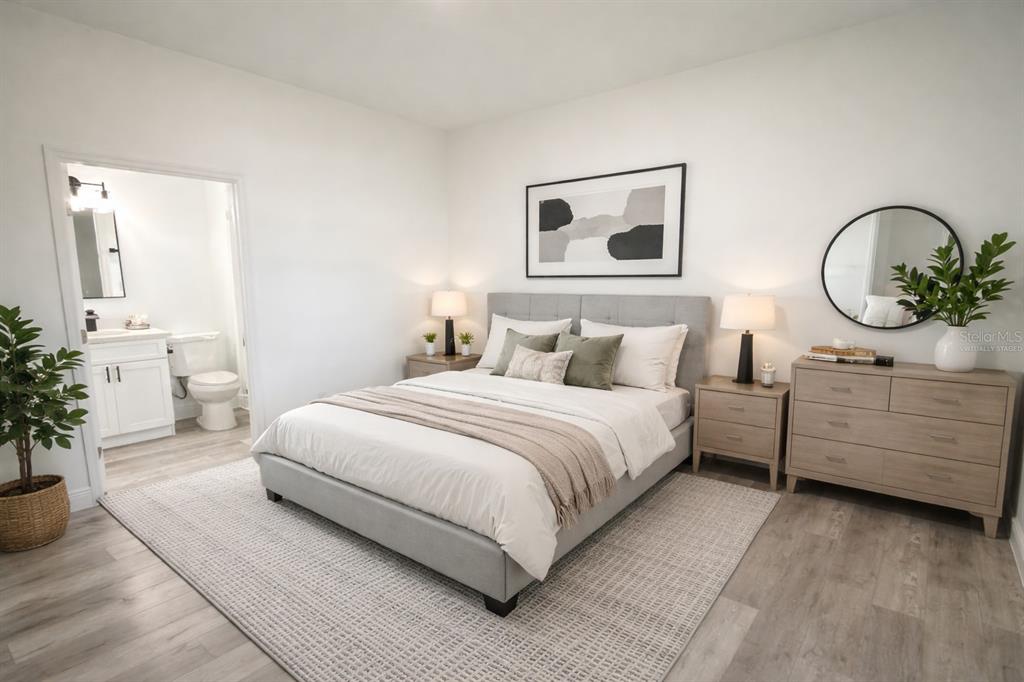 4650 Southwest 139th Place Ocala, FL 34473 - Photo 27 of 49 a bedroom with a bed and a painting on the wall