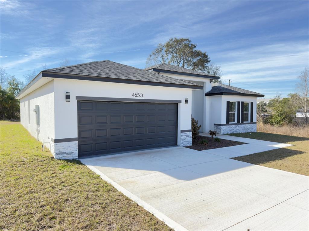 4650 Southwest 139th Place Ocala, FL 34473 - Photo 44 of 49 a view of a house with a outdoor space
