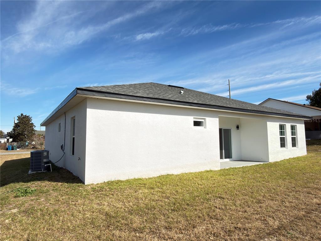 4650 Southwest 139th Place Ocala, FL 34473 - Photo 48 of 49 a front view of a house with a yard