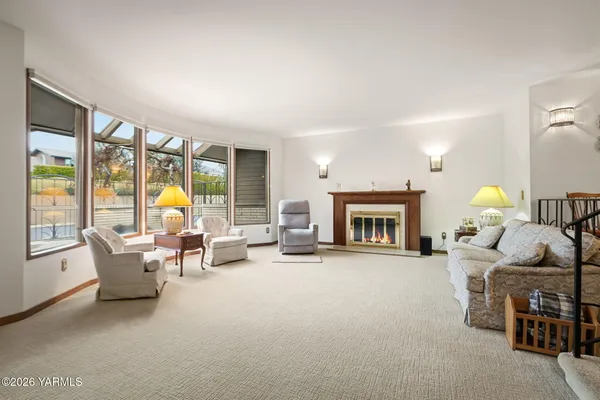 a kitchen with stainless steel appliances granite countertop a sink a refrigerator and a stove