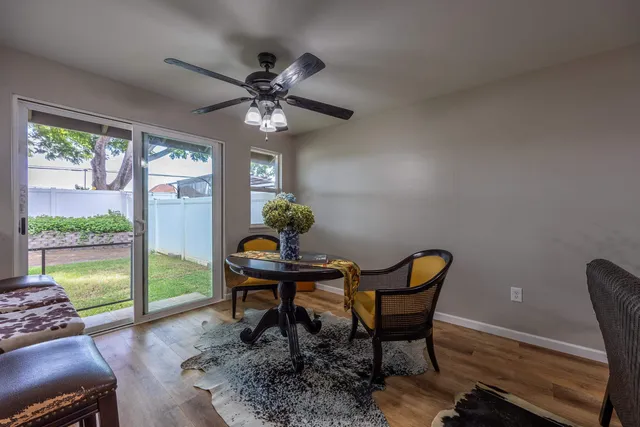 a workspace room with furniture and a window
