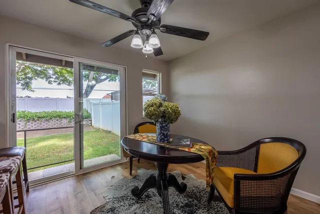 a table room with furniture and wooden floor