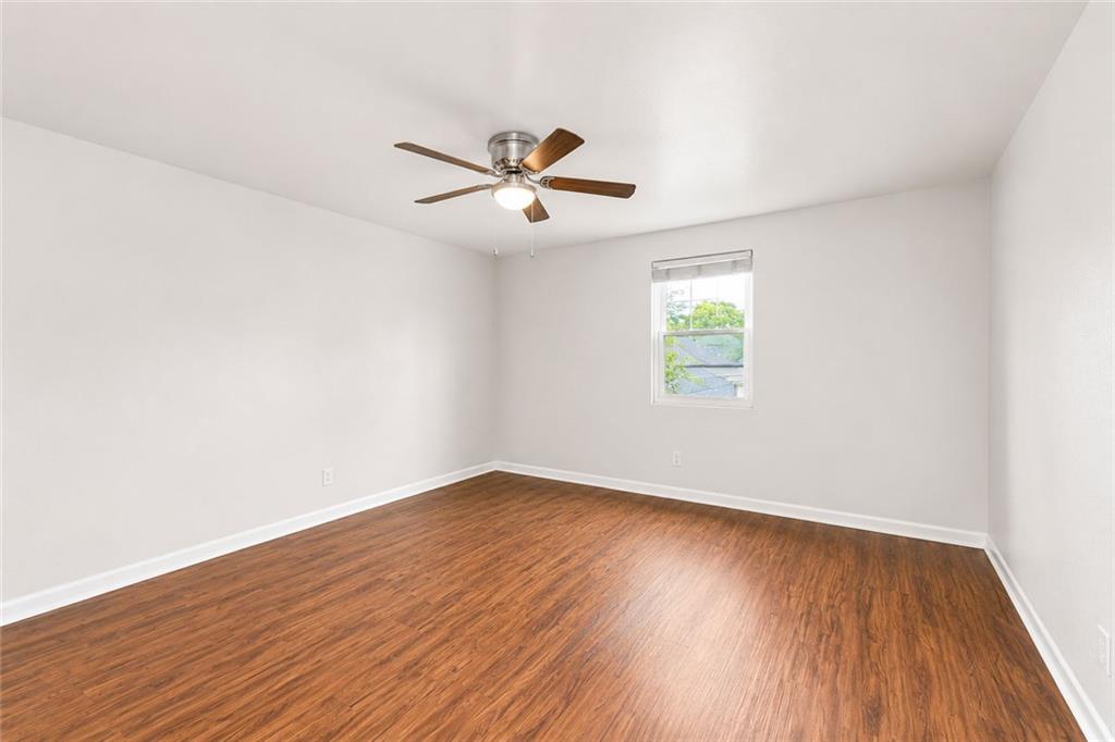 3203 East Point Street, Unit 4 Atlanta, GA 30344 - Photo 14 of 18 wooden floor in an empty room with a window