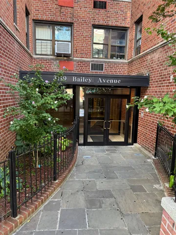 a view of a house with wooden fence