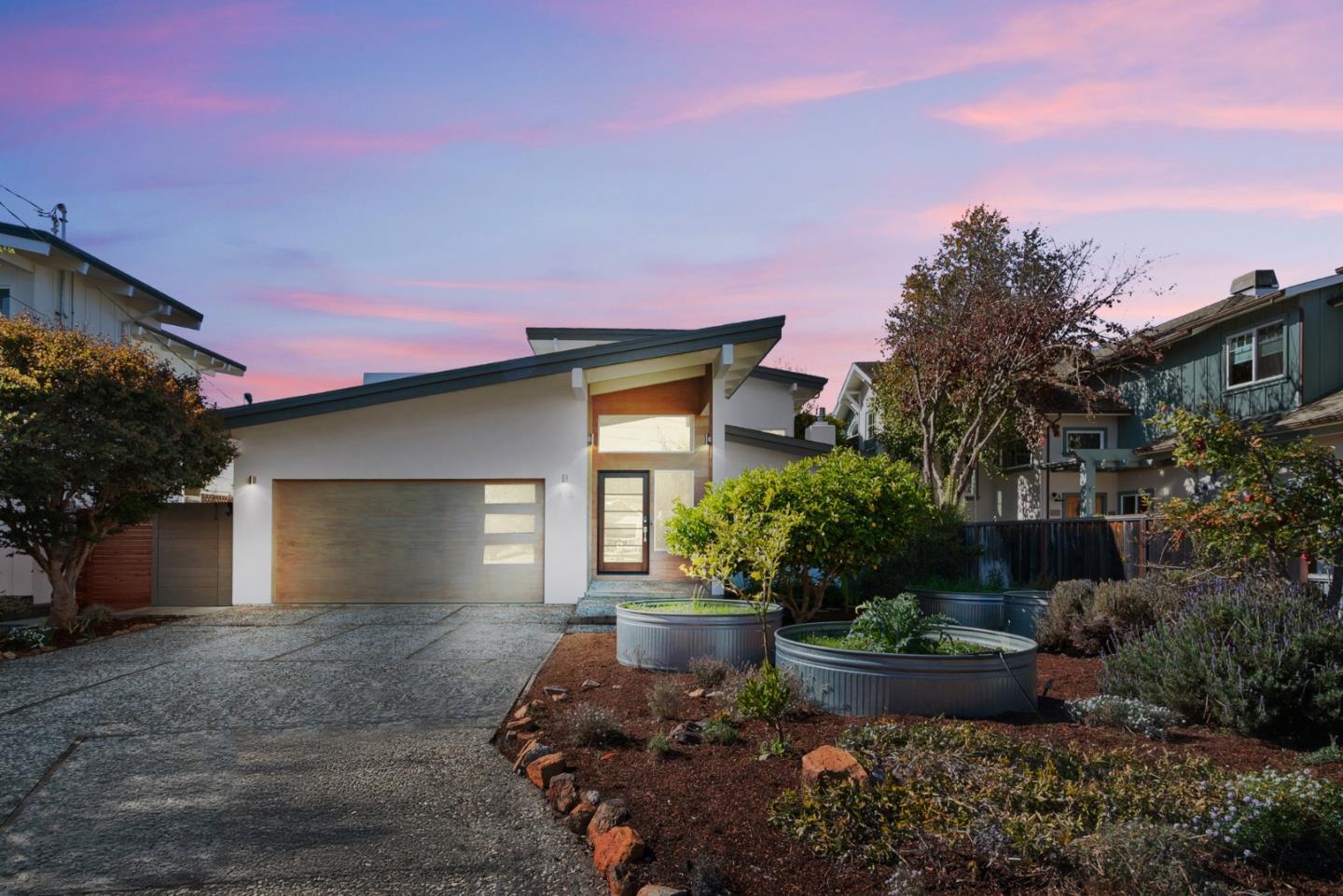 614 Cliff Drive Aptos, CA 95003 - Photo 1 of 1 a front view of a house with a yard and potted plants