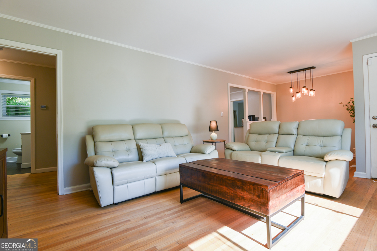 545 Forest Hill Road Macon, GA 31210 - Photo 26 of 63 a living room with furniture and a wooden floor