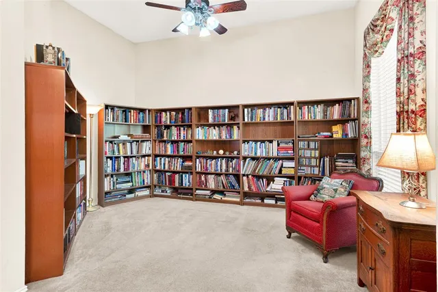 a reading room with furniture and book shelf