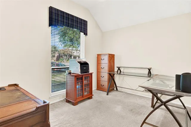 a view of workspace with furniture and window