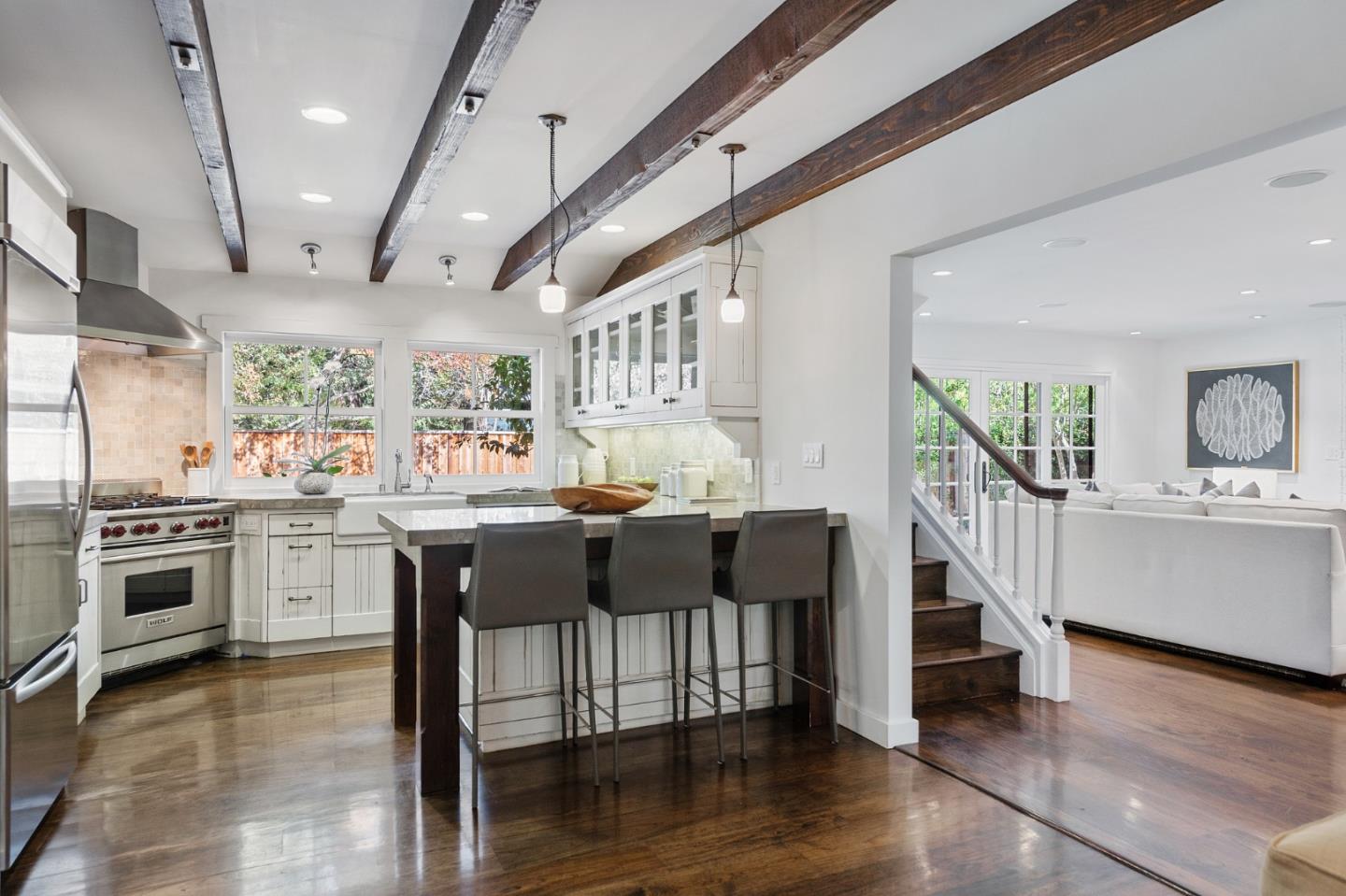 1275 Cañada Road Woodside, CA 94062 - Photo 15 of 62 a kitchen with lots of counter and chairs