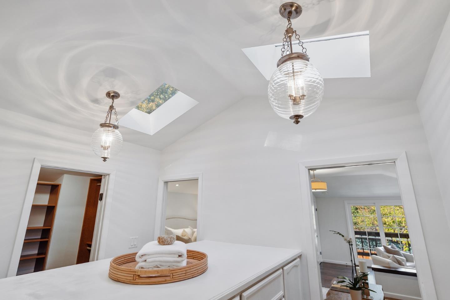 1275 Cañada Road Woodside, CA 94062 - Photo 24 of 62 a dining room with wooden floor a chandelier a wooden table and chairs