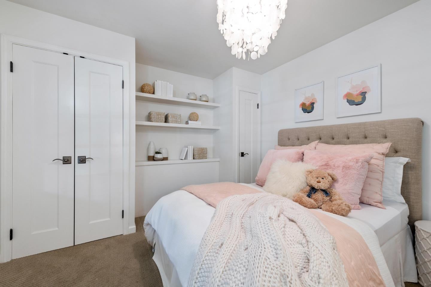 1275 Cañada Road Woodside, CA 94062 - Photo 32 of 62 a bedroom with a large bed and a chandelier