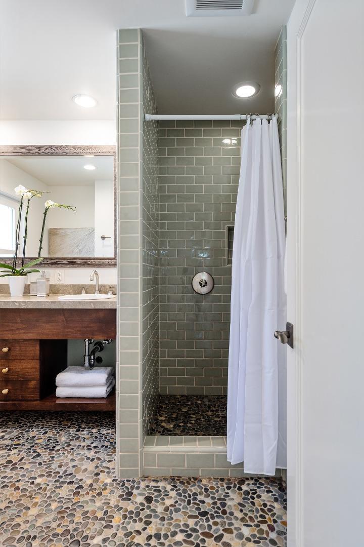 1275 Cañada Road Woodside, CA 94062 - Photo 34 of 62 a bathroom with a granite countertop sink a toilet and shower