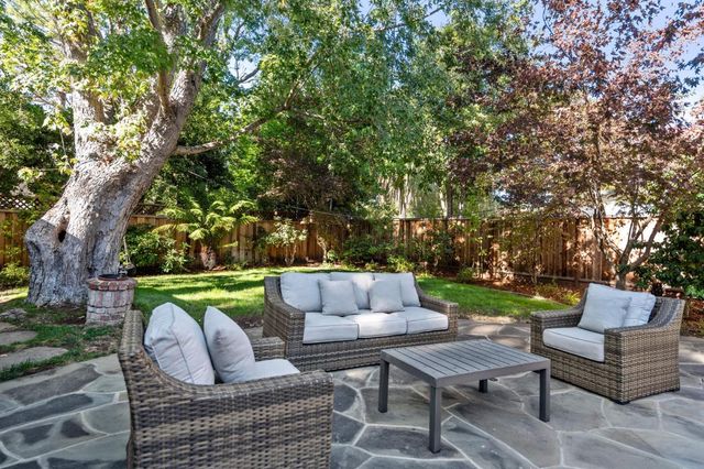 a view of a house with a street