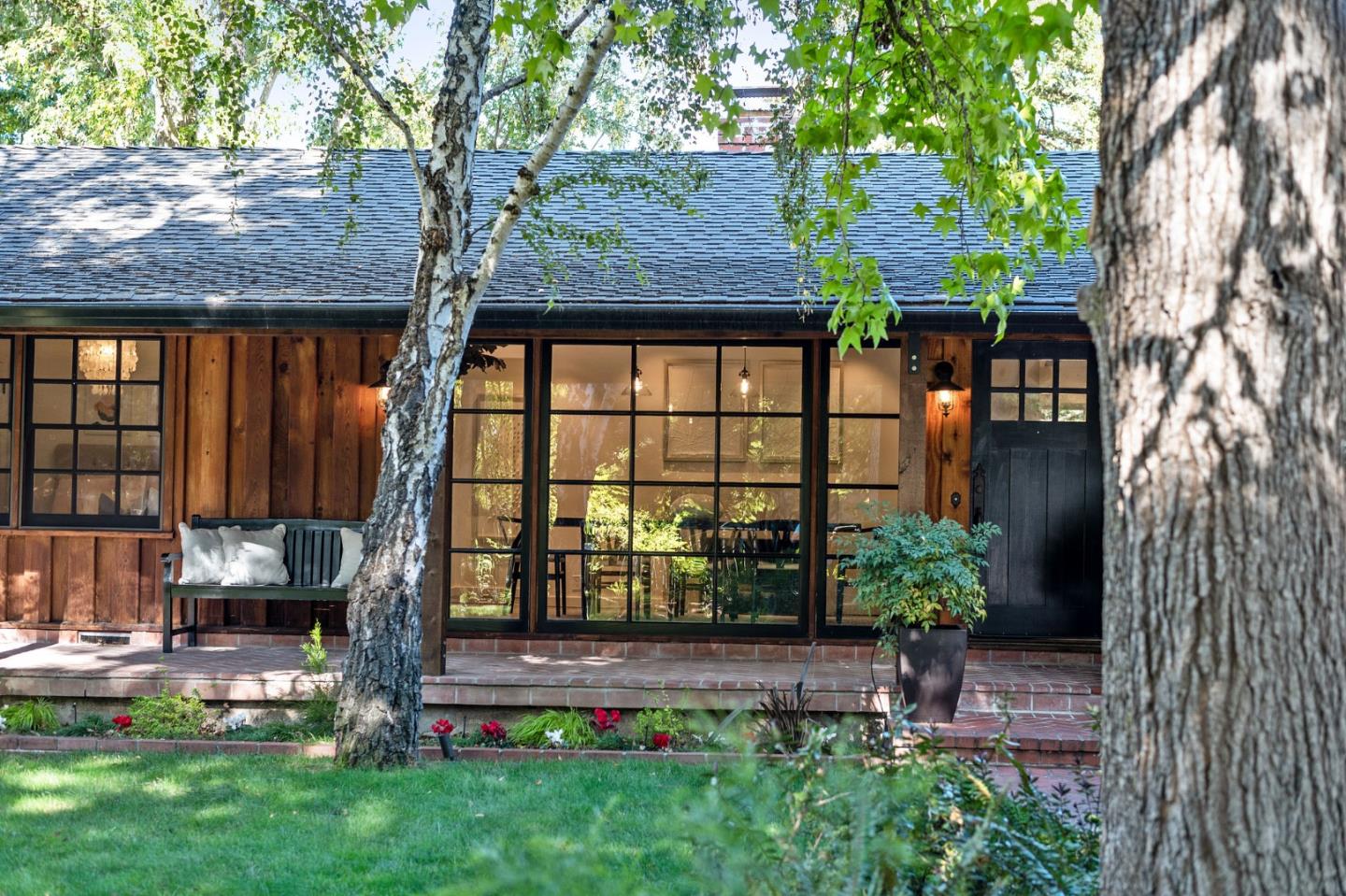 1275 Cañada Road Woodside, CA 94062 - Photo 6 of 62 a backyard of a house with seating space and trees