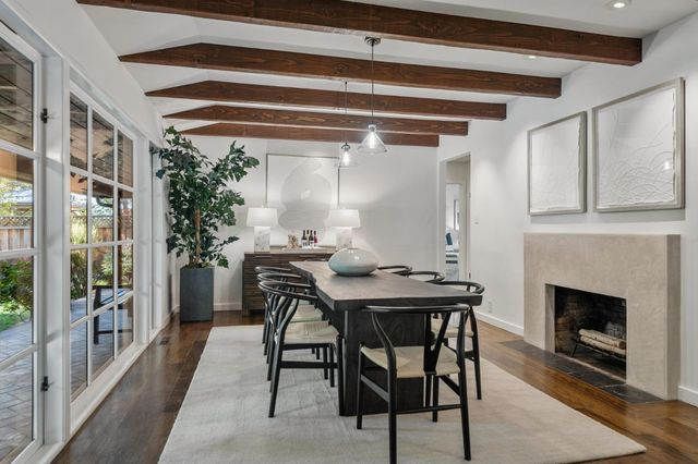 a view of a table and chairs in the room
