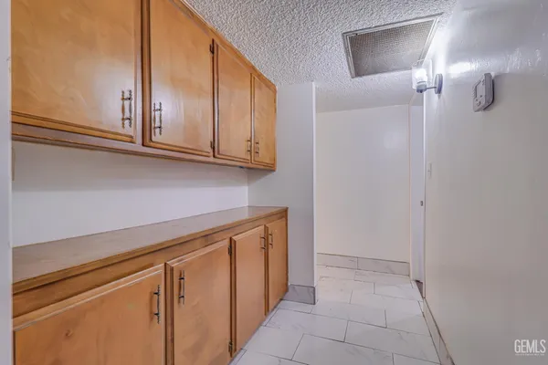 a view of cabinets with wooden floor
