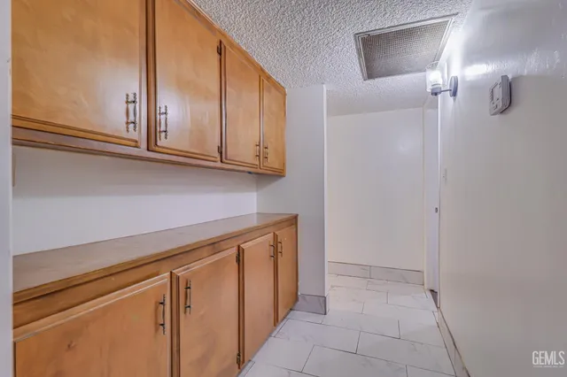 a view of cabinets with wooden floor