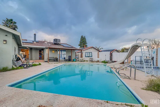 a view of a house with swimming pool