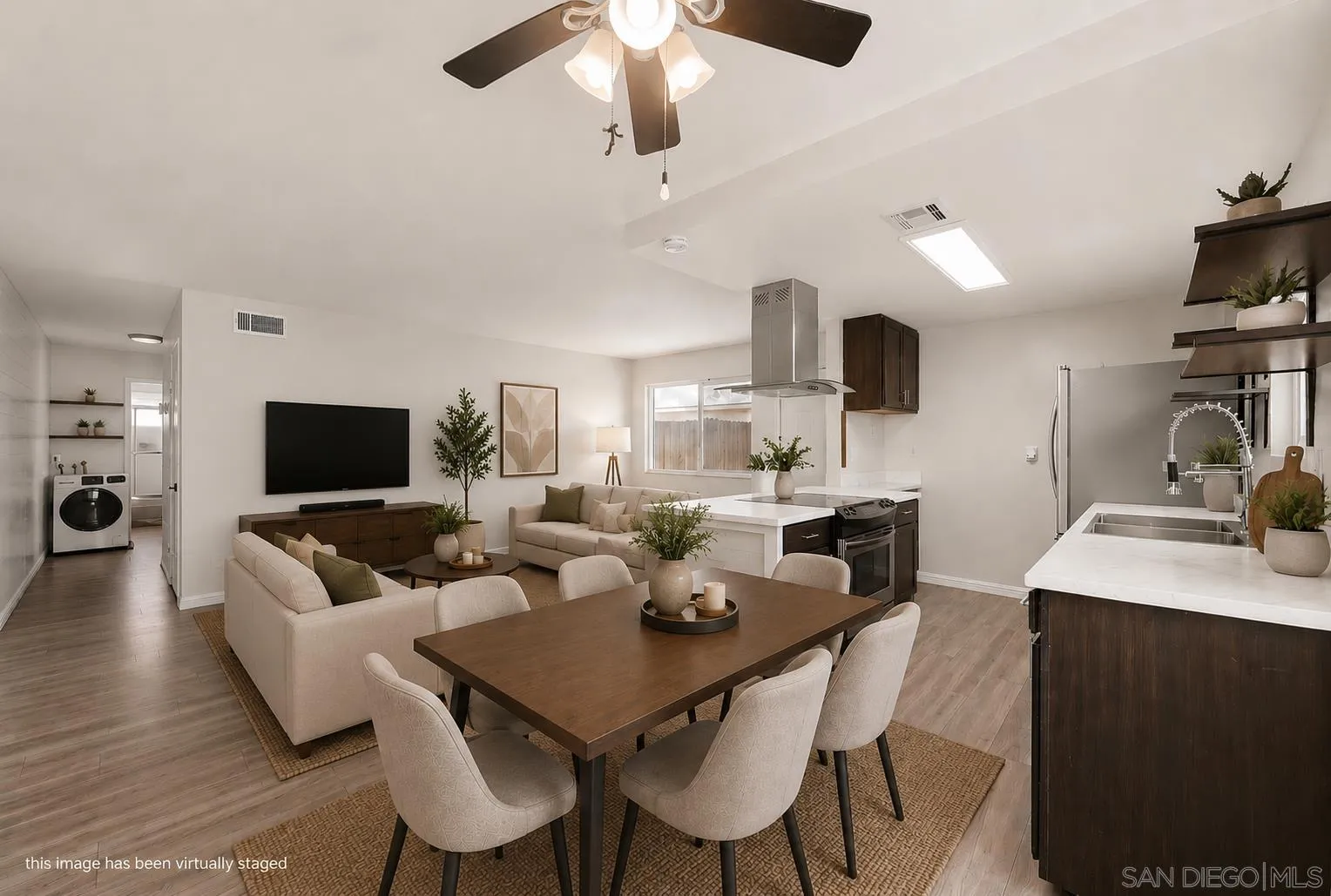 9926 Mission Vega Road, Unit 4 Santee, CA 92071 - Photo 10 of 30 a living room with furniture a flat screen tv and kitchen view