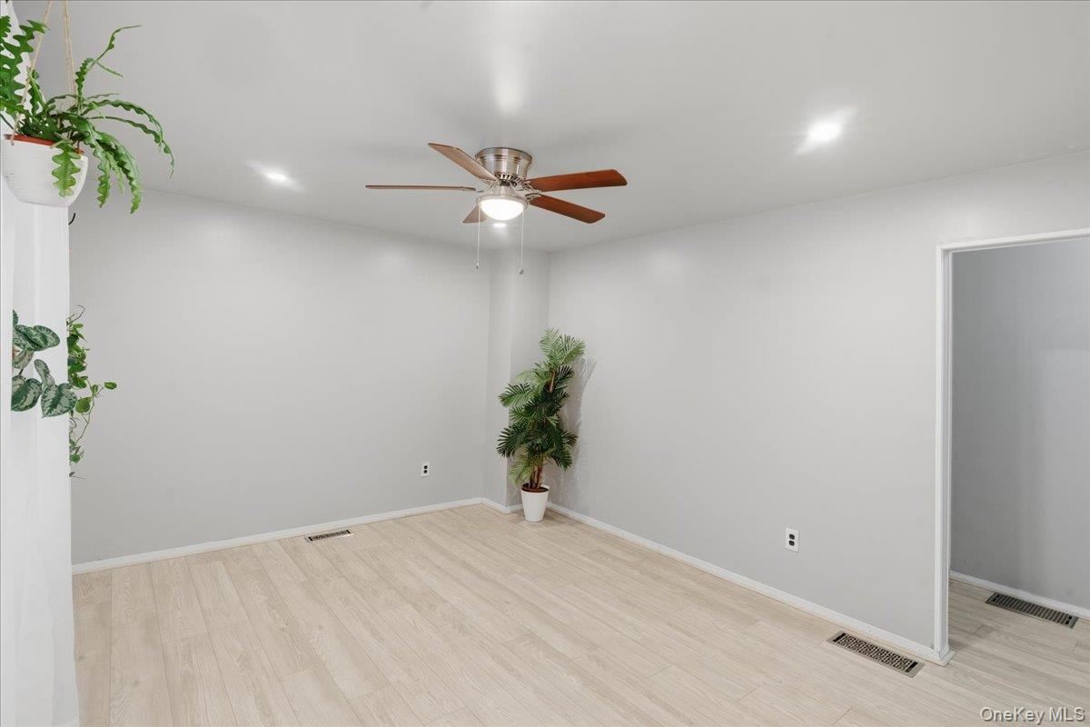 30 George Drive Mastic, NY 11950 - Photo 13 of 26 a view of a room with a potted plant