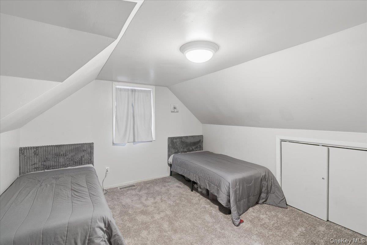 30 George Drive Mastic, NY 11950 - Photo 17 of 26 a living room with furniture and white walls