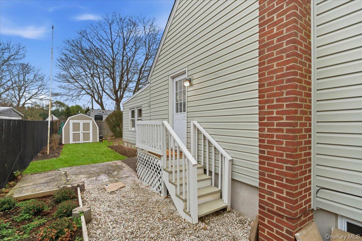 30 George Drive Mastic, NY 11950 - Photo 26 of 26 a view of a house with a yard and tree s