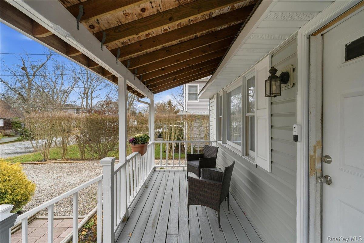 30 George Drive Mastic, NY 11950 - Photo 5 of 26 a view of balcony with couch