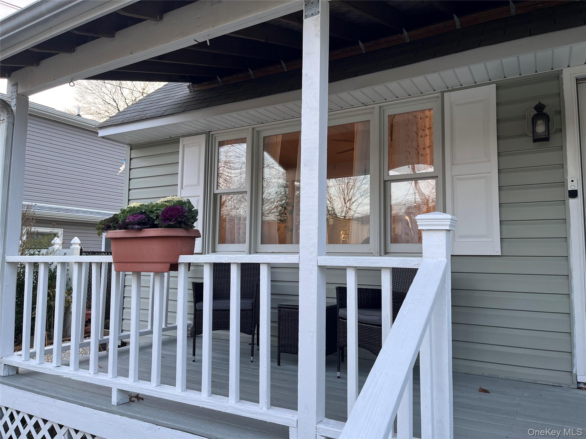 30 George Drive Mastic, NY 11950 - Photo 6 of 26 a view of a house with wooden porch