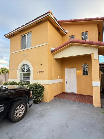 a front view of a house with parking